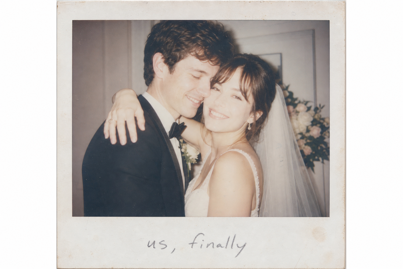 Polaroid-style instant photo of newlyweds with handwritten caption